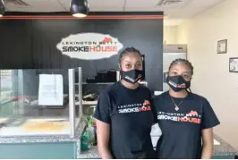  ??  ?? Pullman’s Lexington Betty’s Smoke House co-owner Tanisha Leach (left, with an employee) says her business is weathering the storm amid ongoing protests.