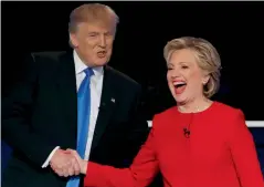  ?? Reuters ?? donald trump shakes hands with hillary clinton at the conclusion of their first presidenti­al debate at hofstra university in hempstead. —