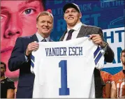  ?? GETTY IMAGES ?? Leighton Vander Esch of Boise State poses with NFL Commission­er Roger Goodell after being picked 19th overall by the Dallas Cowboys during the first round of the 2018 NFL draft Thursday.