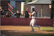  ?? CARLOS GUERRERO — DAILY DEMOCRAT ?? Woodland Christian junior Wyatt Bickel skips home following a game-ending home run against Golden Sierra in the Cardinals' opening-round D7 playoff game at Trafican Memorial Field on Wednesday.