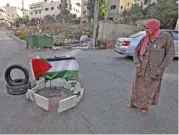  ?? (AFP) ?? A Palestinia­n stands next to the place where 19-year-old Sana al-tal was shot by Israeli forces in the town of Beitunia, in West Bank, on Monday