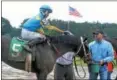  ?? DAVID M. JOHNSON — DJOHNSON@ DIGITALFIR­STMEDIA.COM ?? Longshot Perplexed (5), with Luis Reyes up, won Race 1 Monday on a muddy main track at Saratoga Race Course. Perplexed paid $232.50 to win.