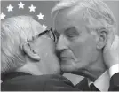  ?? GEERT VANDEN WIJNGAERT THE ASSOCIATED PRESS ?? European Commission President Jean-Claude Juncker, left, kisses European Union chief Brexit negotiator Michel Barnier during a media conference at the conclusion of an EU summit in Brussels on Sunday.