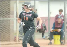  ?? TIM COOK/THE DAY ?? Fitch’s Caroline Taber is all smiles as she nears home plate after hitting a two-run homer in the first inning of the Falcons’ 2-1 win over East Lyme on Wednesday afternoon.