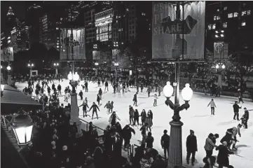  ?? ABEL URIBE/CHICAGO TRIBUNE ?? Dozens of people skate during the official opening of the Millennium Park Ice Rink on Nov. 16.