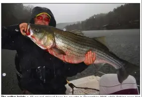  ?? (Submitted photo) ?? The author hoists a 42-pound striped bass he caught in December 2015 while fishing near Hot Springs with his daughter Amy and guide Ron Waymack. It was one of only two fish caught that day, but they were lifetime trophies for both.