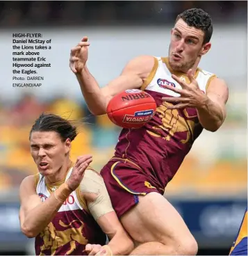  ?? Photo: DARREN ENGLAND/AAP ?? HIGH-FLYER: Daniel McStay of the Lions takes a mark above teammate Eric Hipwood against the Eagles.