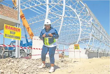  ??  ?? STEPPING UP: Sikuphiwe Trading owner Ncebakazi Mhlaba at the constructi­on site of the new Hella facility at the Coega Special Economic Zone