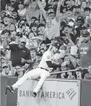  ?? Karen Warren/Staff photograph­er ?? Astros right fielder Kyle Tucker catches a foul ball by the Yankees’ Gleyber Torres on Thursday.