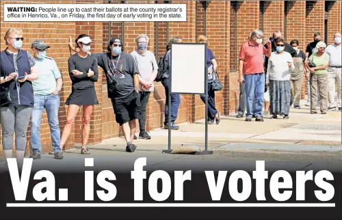  ??  ?? WAITING: People line up to cast their ballots at the county registrar’s office in Henrico, Va., on Friday, the first day of early voting in the state.