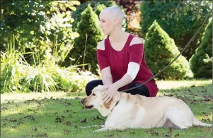  ?? SUBMITTED PHOTO ?? P.E.I. native Karen Nicholson pets family dog Skye shortly before getting married in Halifax last September. Nicholson had planned to marry Taha Abbasi in Toronto, but the couple made alternate arrangemen­ts after Nicholson was diagnosed with leukemia.