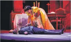  ??  ?? Tosca (Amarilli Nizza) places the crucifix on Scarpia's (Lucio Gallo) dead body in an act of poignant drama just before the curtain falls on Act 2. Photo: Shaun Sultana