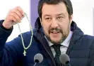  ??  ?? Italy’s far-right leader Matteo Salvini often brandishes a rosary in public