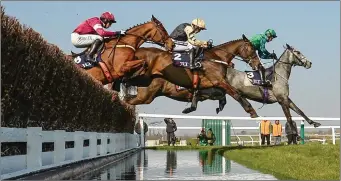  ??  ?? Daryl Jacob clears the water jump in first spot on Bristol De Mai in the JLT Novices’ Steeplecha­se last year.