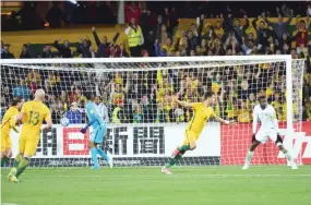  ??  ?? Tomi Juric of Australia celebrates after scoring a goal during the World Cup football Asian qualifying match between Australia and Saudi Arabia at the Adelaide Oval in Adelaide on Thursday. (AFP)