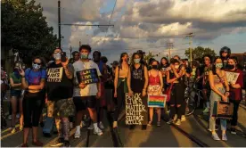  ??  ?? Protesters stand on a road during a march against the shooting of Jacob Blake in Kenosha, Wisconsin, on 27 August. Photograph: Kerem Yucel/AFP/Getty Images