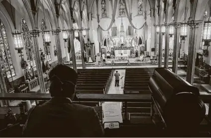  ?? Ryan Christophe­r Jones / New York Times file photo ?? Easter Mass is livestream­ed from a mostly empty Catholic church in Brooklyn in this April photo. The Supreme Court barred restrictio­ns on religious services in New York that Gov. Andrew Cuomo had imposed to combat the coronaviru­s.