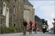  ?? PETER DEJONG — THE ASSOCIATED PRESS ?? France Jerome Cousin, left, France’s Pierre Roger Latour, and Belgium’s Dimitri Claeys ride in a breakaway during the fourth stage of the Tour de France cycling race over 121 miles with start in La Baule and finish in Sarzeau, France, Tuesday, July 10, 2018.