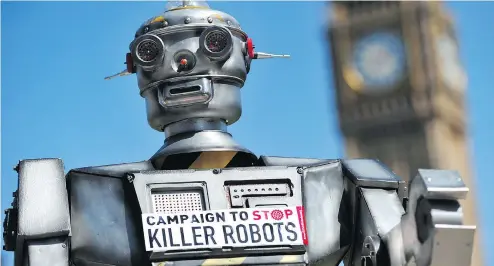  ?? CARL COURT / AFP / GETTY IMAGES FILES ?? A file photo shows a mock “killer robot” in central London during the launching of the Campaign to Stop “Killer Robots.”