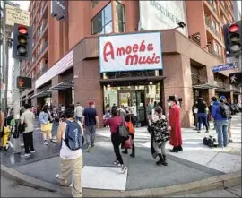  ?? Photograph­s by Mel Melcon Los Angeles Times ?? AMOEBA MUSIC reopens Thursday at its new location, at Hollywood Boulevard and Argyle Avenue, after being closed about a year due to the coronaviru­s crisis.