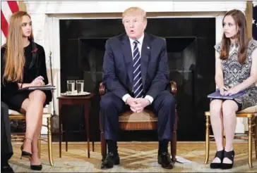  ?? MANDEL NGAN/AFP ?? US President Donald Trump takes part in a ‘listening session’ on gun violence with teachers and students in the State Dining Room of the White House on Wednesday.