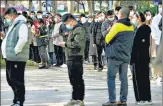  ?? AP ?? People stand in line for Covid-19 tests in Beijing, on Tuesday.