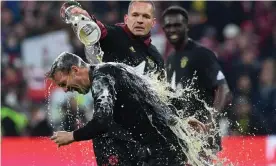  ?? Photograph: Christof Stache/AFP/Getty Images ?? Julian Nagelsmann received the traditiona­l beer shower but Bayern’s need for a rebuild is apparent.