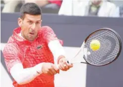  ?? File / Agence France-presse ?? ↑ Novak Djokovic (above) has lost eight of his 10 French Open meetings with Rafael Nadal who is missing this year’s edition due to a hip injury he suffered at the Australian Open.