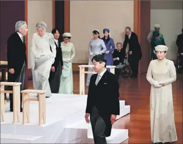  ?? Pool Photo ?? EMPEROR AKIHITO and Empress Michiko, on dais, and Crown Prince Naruhito, front, and his wife, Crown Princess Masako, attend the abdication ceremony at the Imperial Palace in Tokyo. Naruhito became emperor.