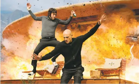  ??  ?? Grim and grimmer: Sacha Baron Cohen and Mark Strong in The Brothers Grimsby, at Regal Stadium 14 and Violet Crown