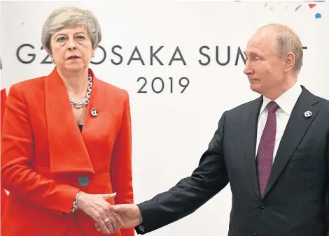  ?? Picture: PA. ?? PM Theresa May made her displeasur­e with Russia’s “irresponsi­ble” actions clear to President Putin.
