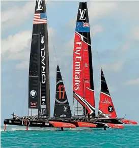  ?? PHOTO: REUTERS ?? Team NZ and Oracle duel in the opening round clash at the America’s Cup qualifying series in Bermuda yesterday.