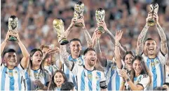  ?? REUTERS ?? Argentina’s Lionel Messi, centre, and teammates celebrate with their families after the match against Panama.