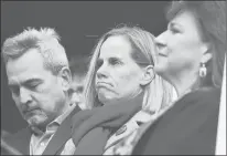  ?? ASSOCIATED PRESS ?? In this Nov. 27, 2018, photo, Michael Song, left, and his wife, Kristin, center, attend a news conference about gun safety following the accidental shooting death of their son, Ethan. At right is the Rev. Ginger Brasher-Dunningham. The Songs settled their lawsuit against the owner of the gun for $1 million.