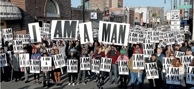  ?? AP ?? People carry signs similar to those used by striking sanitation workers who were supported by Dr Martin Luther King Jr in 1968, at an event in Memphis commemorat­ing King’s assassinat­ion there 50 years ago.