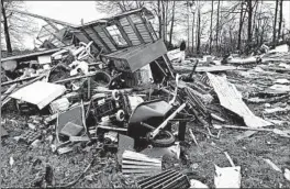  ?? LT. BILL DAVIS/BOSSIER PARISH SHERIFF'S OFFICE ?? Damage from severe weather killed three people in Louisiana, including an elderly couple. The National Weather Service said a 135 mph tornado touched down in Bossier Parish.