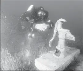  ??  ?? Dixon discovered a water pump at the submerged town of Minnewanka Landing in Banff National Park. It’s just one of the underwater sites found in Alberta and B.C.