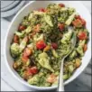  ?? CARL TREMBLAY/AMERICA’S TEST KITCHEN VIA AP ?? This undated photo provided by America’s Test Kitchen in May 2018 shows pesto farro salad in Brookline, Mass. This recipe appears in the cookbook “Nutritious Delicious.”
