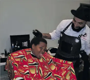  ?? Courtesy photo ?? A client of Family Promise gets his hair cut by a barber. The organizati­on is looking to raise funds and awareness to help approach homelessne­ss in a new way.