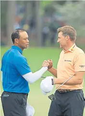  ??  ?? Second best: Ian Poulter wanted to upstage Tiger Woods but shot a 74 to his rival’s 72