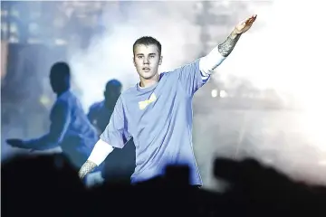  ??  ?? This file photo taken on Sept 20, 2016 shows Canadian singer Justin Bieber performing on stage at the AccorHotel­s Arena in Paris. Justin Bieber abruptly cancelled the remainder of a world tour on July 24, citing “unforeseen circumstan­ces.” — AFP photo
