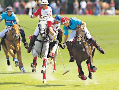  ??  ?? Nina Clarkin, left and above in action in the foreground, wearing blue colours, and below with husband Jean-paul Clarkin, the New Zealand polo star