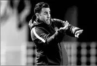  ?? BUDDHIKA WEERASINGH­E / GETTY IMAGES ?? Coach Fabio Cannavaro of Guangzhou Evergrande gestures during Wednesday’s AFC Champions League Group G match against Cerezo Osaka in Osaka, Japan.