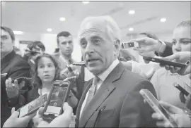  ?? THE ASSOCIATED PRESS ?? Senate Foreign Relations Committee Chairman Sen. Bob Corker, R-Tenn. is surrounded by reporters on Capitol Hill in Washington on July 27. Corker, chairman of the Foreign Relations committee and a foreign policy ally of the Trump White House, had the...