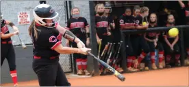  ?? Gail Conner ?? Cedartown’s Carlie Holland makes contact for a home run against Southeast Whitfield during a game Wednesday, Sept. 23, at Cedartown High School. The Lady Bulldogs won 9-1 to complete a series sweep of the Lady Raiders.