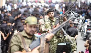  ??  ?? Members of Palestinia­n forces loyal to Hamas take part in a military parade in Gaza City on Wednesday. (AFP)