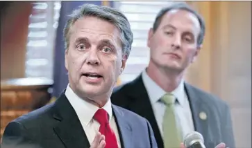  ?? Chris Neal Topeka Capital-Journal ?? “THE NUMBERS are just not there,” Kansas Gov. Jeff Colyer, shown last week at left, said after the latest tally from the Aug. 7 vote showed his rival’s lead had grown. He promptly endorsed his fellow Republican.
