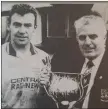  ??  ?? Ciaran Bishop of the WDFL presents Rathnew’s Eamon Franey with the Charlie Bishop Cup.