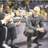  ?? Phelan M. Ebenhack / Associated Press ?? UConn coach Dan Hurley, right, watches from the sideline.