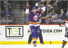  ?? Bruce Bennett / Getty Images ?? Islanders captain John Tavares celebrates after scoring his third goal of the game midway through the third period.